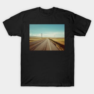 Canadian prairie landscape with a country road near Pincher Creek, Alberta, Canada. T-Shirt